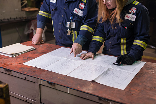 Employees Looking at Paper